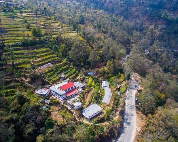 Aerial view of the farm. The farm on the sits at an altitude of 1400m the sea level and faces the Himalayas.